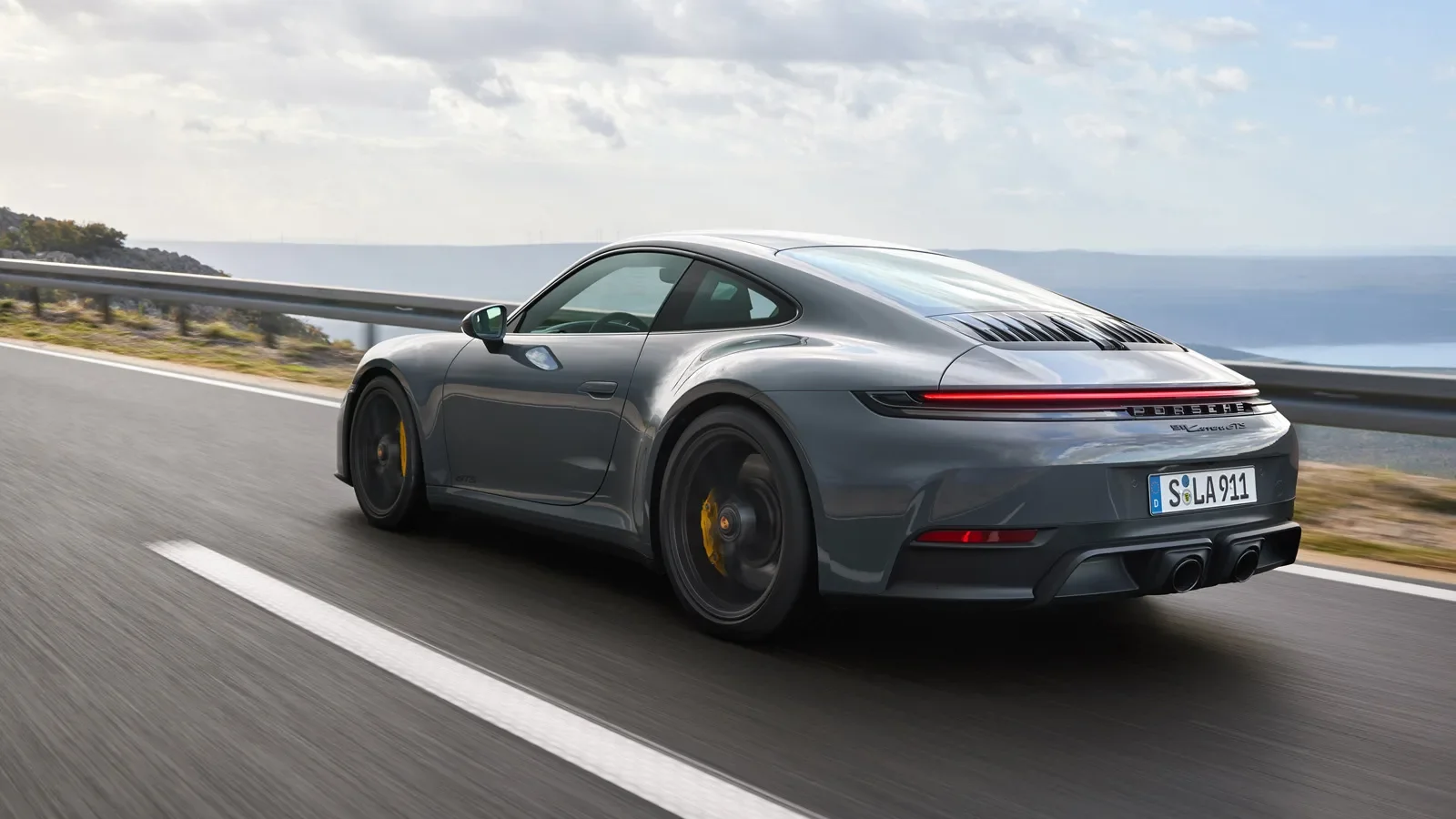 2025-Porsche-911-Carrera-GTS-coupe-action-rear